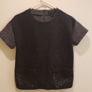 Black top with sparking pockets